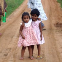 Two girls in pink dresses from Colombo, Sri Lanka thanks to 'Hishan'